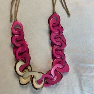 Unusual necklace. Made from Brazil nuts. Sliced and coated then painted.